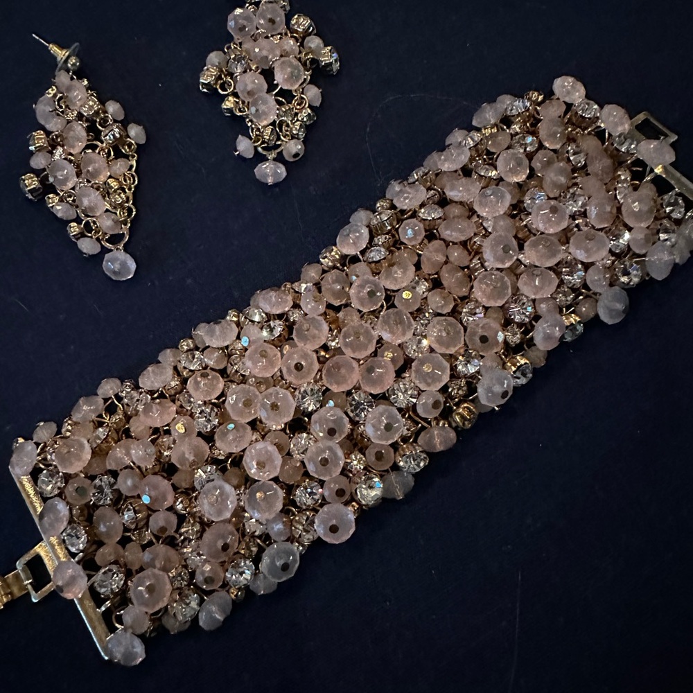 Pink and clear stones in gold bracelet and earrings